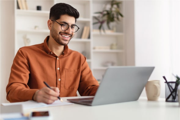 Young Business Man Working On Laptop